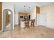 Kitchen featuring an island with barstool seating, stainless steel appliances, and tan and brown tile flooring at 10764 70Th Ave # 5302, Seminole, FL 33772