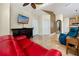 Open living room featuring tile floors, comfortable seating, and a modern entertainment center at 10764 70Th Ave # 5302, Seminole, FL 33772
