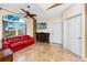 Comfortable living room with vaulted ceilings, a large window, and a flat-screen TV at 10764 70Th Ave # 5302, Seminole, FL 33772