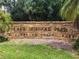 Sign for Lake Seminole Park in Pinellas County with beautiful landscaping at 10764 70Th Ave # 5302, Seminole, FL 33772