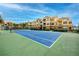 A perfectly maintained community tennis court on a sunny day at 10764 70Th Ave # 5302, Seminole, FL 33772