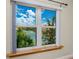 This window shows the beautiful community pool and tennis courts at 10764 70Th Ave # 5302, Seminole, FL 33772