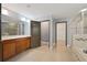 Bathroom featuring double vanity, walk-in shower, and separate water closet at 11006 Tahiti Isle Ln, Tampa, FL 33647