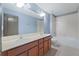 Bathroom features double sinks, wood cabinets, and plenty of counter space at 11006 Tahiti Isle Ln, Tampa, FL 33647