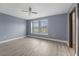 Spacious bedroom featuring a ceiling fan and large windows that let in natural light at 11006 Tahiti Isle Ln, Tampa, FL 33647