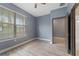 Bedroom features wood-look flooring and a sunlit window at 11006 Tahiti Isle Ln, Tampa, FL 33647