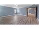 Spacious bedroom features hardwood floors, ceiling fan, and a window for natural light at 11006 Tahiti Isle Ln, Tampa, FL 33647