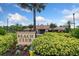 Beach Club community sign nestled amid lush greenery and palm trees at 11006 Tahiti Isle Ln, Tampa, FL 33647