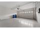 Garage featuring epoxy flooring and automatic door at 11006 Tahiti Isle Ln, Tampa, FL 33647