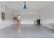 Garage featuring epoxy flooring, water heater, and electrical panel at 11006 Tahiti Isle Ln, Tampa, FL 33647