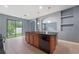 Kitchen island with sink and dishwasher overlooks the backyard at 11006 Tahiti Isle Ln, Tampa, FL 33647