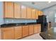 This kitchen has wood cabinets, granite countertops, and stainless steel appliances at 11006 Tahiti Isle Ln, Tampa, FL 33647