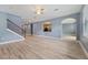 Living room with new flooring, stairs, and view to the kitchen at 11006 Tahiti Isle Ln, Tampa, FL 33647
