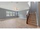 Spacious living room with new wood floors and staircase at 11006 Tahiti Isle Ln, Tampa, FL 33647