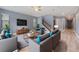 Cozy living room with gray sofas and a mounted tv at 11006 Tahiti Isle Ln, Tampa, FL 33647