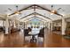 Spacious lounge area with vaulted ceilings, ceiling fans, seating and wood floors at 11006 Tahiti Isle Ln, Tampa, FL 33647
