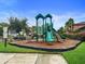 Fun community playground with modern equipment and safety surfacing at 11006 Tahiti Isle Ln, Tampa, FL 33647