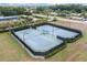 Community tennis courts with professional lighting and well maintained surface at 11006 Tahiti Isle Ln, Tampa, FL 33647