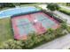 Community tennis courts with professional lighting and well maintained surface at 11006 Tahiti Isle Ln, Tampa, FL 33647