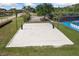 Beautifully maintained sand volleyball court surrounded by lush landscaping at 11006 Tahiti Isle Ln, Tampa, FL 33647