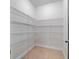 Walk-in closet with lots of wire shelving for storage at 11006 Tahiti Isle Ln, Tampa, FL 33647