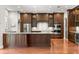 Gourmet kitchen with stainless steel appliances, granite countertops, and custom cabinetry at 1171 Red Maple Ne Cir, St Petersburg, FL 33703