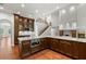 Gourmet kitchen featuring granite countertops, a large island, and wood cabinets at 1171 Red Maple Ne Cir, St Petersburg, FL 33703