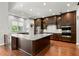 Gourmet kitchen featuring a large island, stainless steel appliances, and custom cabinetry at 1171 Red Maple Ne Cir, St Petersburg, FL 33703