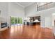 Spacious living room featuring a fireplace, hardwood floors, and sliding glass doors to the outside at 1171 Red Maple Ne Cir, St Petersburg, FL 33703