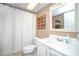 The bathroom offers a sink, toilet and shower with modern fixtures and a decorative mirror at 12300 Park Blvd # 222, Seminole, FL 33772