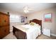 This cozy bedroom features a comfortable bed, a ceiling fan, and a spacious wooden dresser at 12300 Park Blvd # 222, Seminole, FL 33772