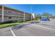 Exterior view of the two-story building with parking, reserved space available at 12300 Park Blvd # 222, Seminole, FL 33772