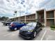 Exterior view of the two-story condo buildings with assigned parking at 12300 Park Blvd # 222, Seminole, FL 33772