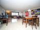 View of a living room flowing into dining space with modern decor and neutral color palette at 12300 Park Blvd # 222, Seminole, FL 33772