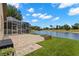 Paver patio and large lake in the backyard at 12339 Roseland Dr, New Port Richey, FL 34654