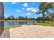 Paver patio overlooks lake at 12339 Roseland Dr, New Port Richey, FL 34654