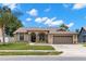 Charming single-story home with a well-maintained lawn, inviting entrance, and convenient two-car garage at 12339 Roseland Dr, New Port Richey, FL 34654