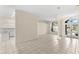 Open-concept entryway boasting tile floors, double doors, and seamless flow into the living spaces at 12339 Roseland Dr, New Port Richey, FL 34654