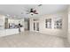 Bright living space with tiled floors leads to a modern kitchen with stainless steel appliances at 12339 Roseland Dr, New Port Richey, FL 34654