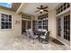 Covered patio with dining set and access to the outdoors at 12339 Roseland Dr, New Port Richey, FL 34654