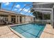 Screened-in pool and patio area; ideal for enjoying the outdoors at 12339 Roseland Dr, New Port Richey, FL 34654