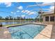 Sparkling pool with a screen enclosure, perfect for enjoying the outdoors bug-free at 12339 Roseland Dr, New Port Richey, FL 34654
