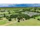 Expansive aerial view showcases the vast property surrounded by lush greenery and natural landscape at 12434 Cody Dr, Wimauma, FL 33598