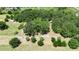 Lush acreage features mature trees and green pasture, offering privacy and natural beauty at 12434 Cody Dr, Wimauma, FL 33598