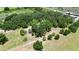 Picturesque property surrounded by mature trees and green pasture, offering privacy and beauty at 12434 Cody Dr, Wimauma, FL 33598