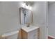 Updated bathroom with modern vanity, stylish lighting, and neutral finishes for a fresh, clean aesthetic at 12434 Cody Dr, Wimauma, FL 33598