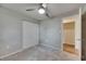 Bedroom features neutral carpet, ceiling fan, and closet providing comfort and functionality at 12434 Cody Dr, Wimauma, FL 33598