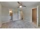 Bedroom features a ceiling fan and two entryways at 12434 Cody Dr, Wimauma, FL 33598