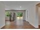 Bright kitchen boasts stainless steel appliances, white cabinetry, and a sliding door to the backyard at 12434 Cody Dr, Wimauma, FL 33598