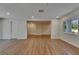 Spacious living room with new floors, neutral walls, and an open concept design at 12434 Cody Dr, Wimauma, FL 33598